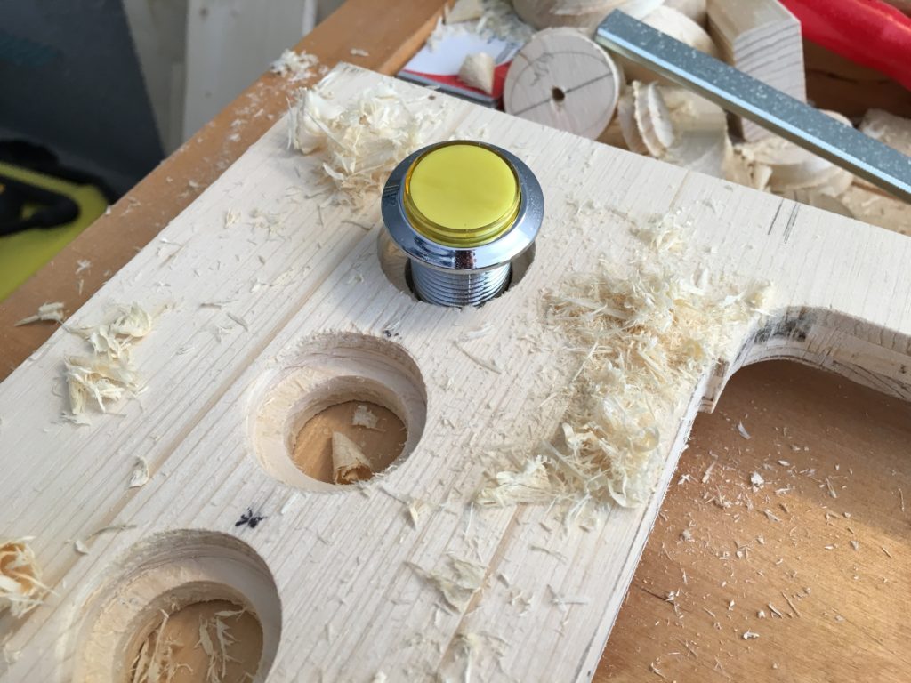 The LED arcade buttons were first sunk with a 50mm Fostner drill and then the hole drilled with a 35mm round drill. The edges are later mirrored around.