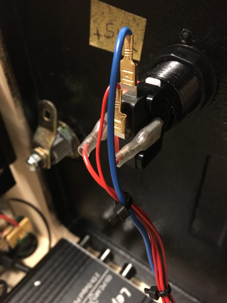 5V LED coin button, mounted in the service door of the pinball.